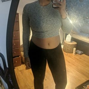 Comfortable grey crop top. Slight turtle neck.